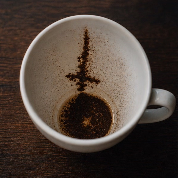 DAGGER coffee cup symbol photo and tasseography meaning